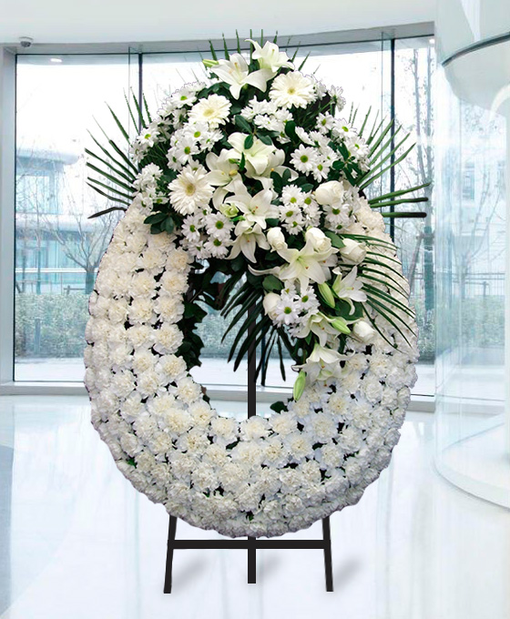 Enviar Corona Lagrima Clavel Blanco